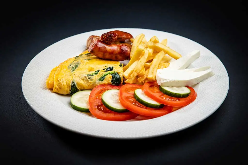 Omelette With Sausages, Young Cheese and Spinach